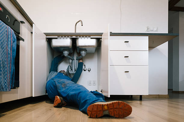 Professional Drain Cleaning technician working in Milton Village, MA